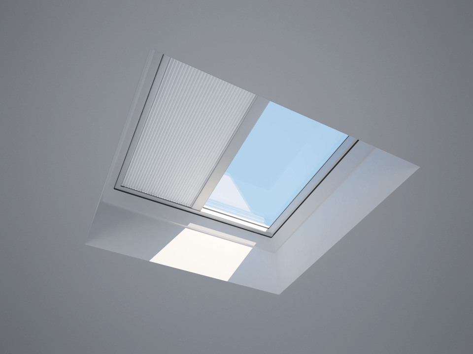 a flat roof window with a blind