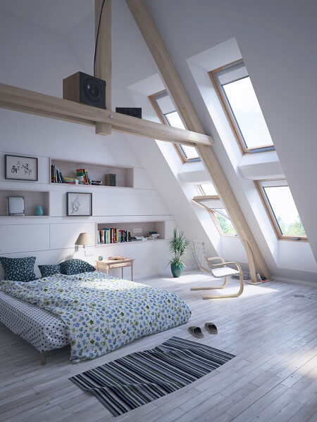 A bedroom with bookcase built in