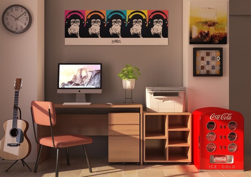 Desk with colourful posters above it and a bright red filing cupboard