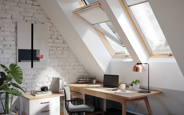 Pitched roof windows providing natural light to a loft office space