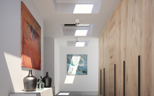 Flat roof windows in a long interior hallway.