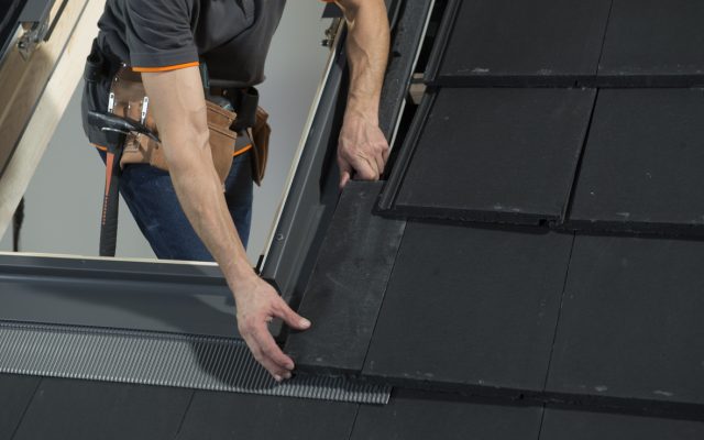 Dakea professional roof window installer placing window flashing