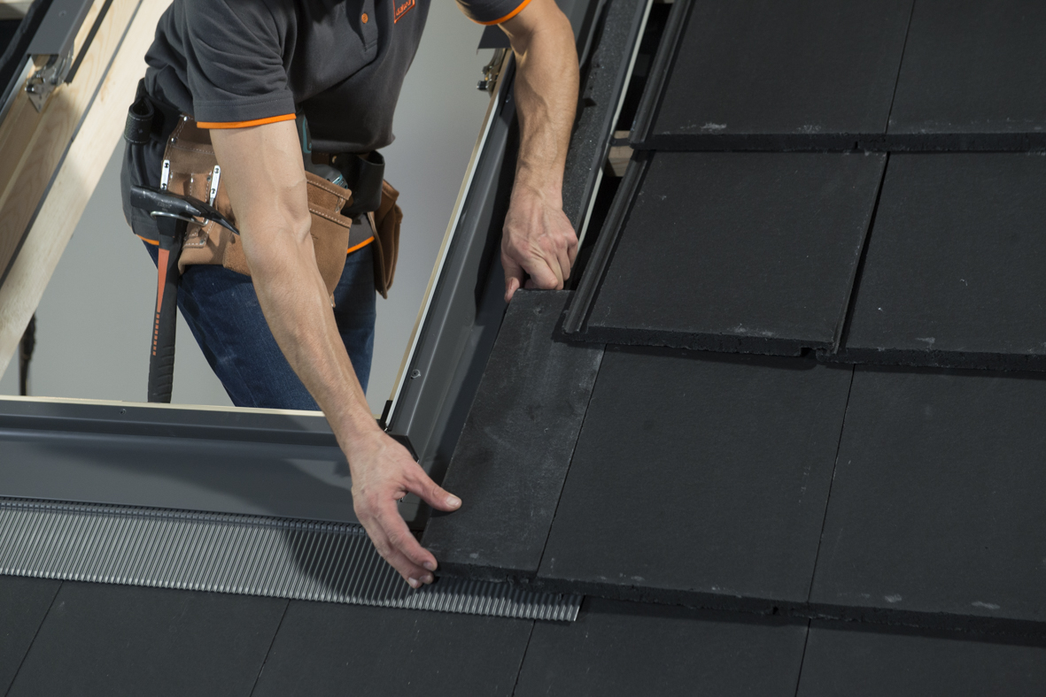 Dakea professional roof window installer placing window flashing