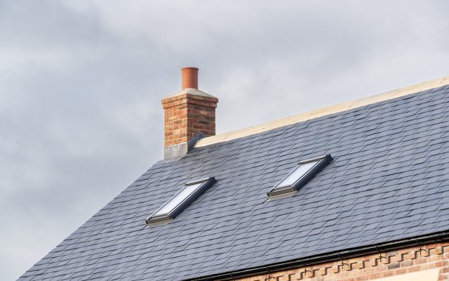 Roof windows installed for loft conversion, viewed from external.