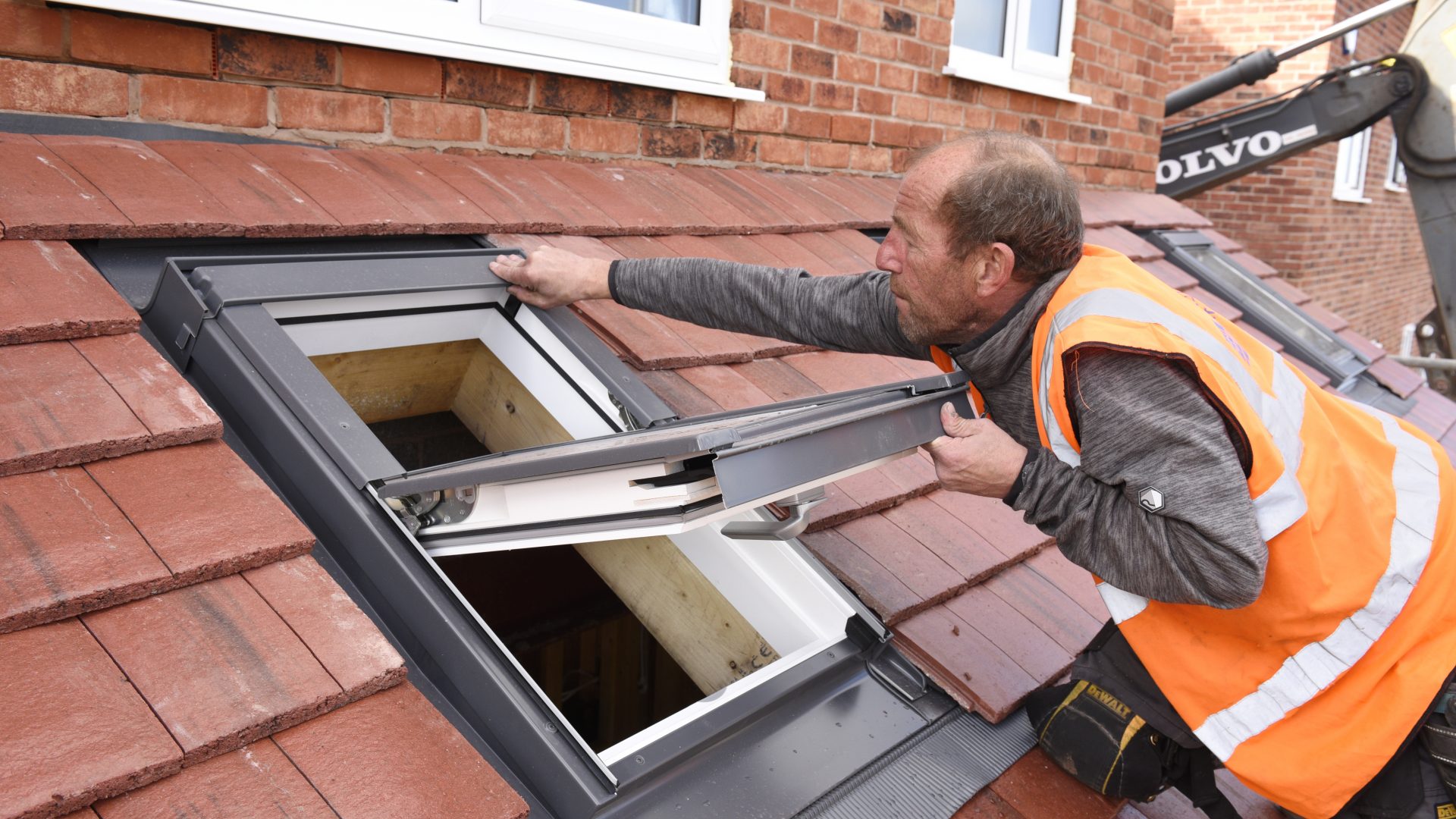 Installer fixing a Dakea roof window.